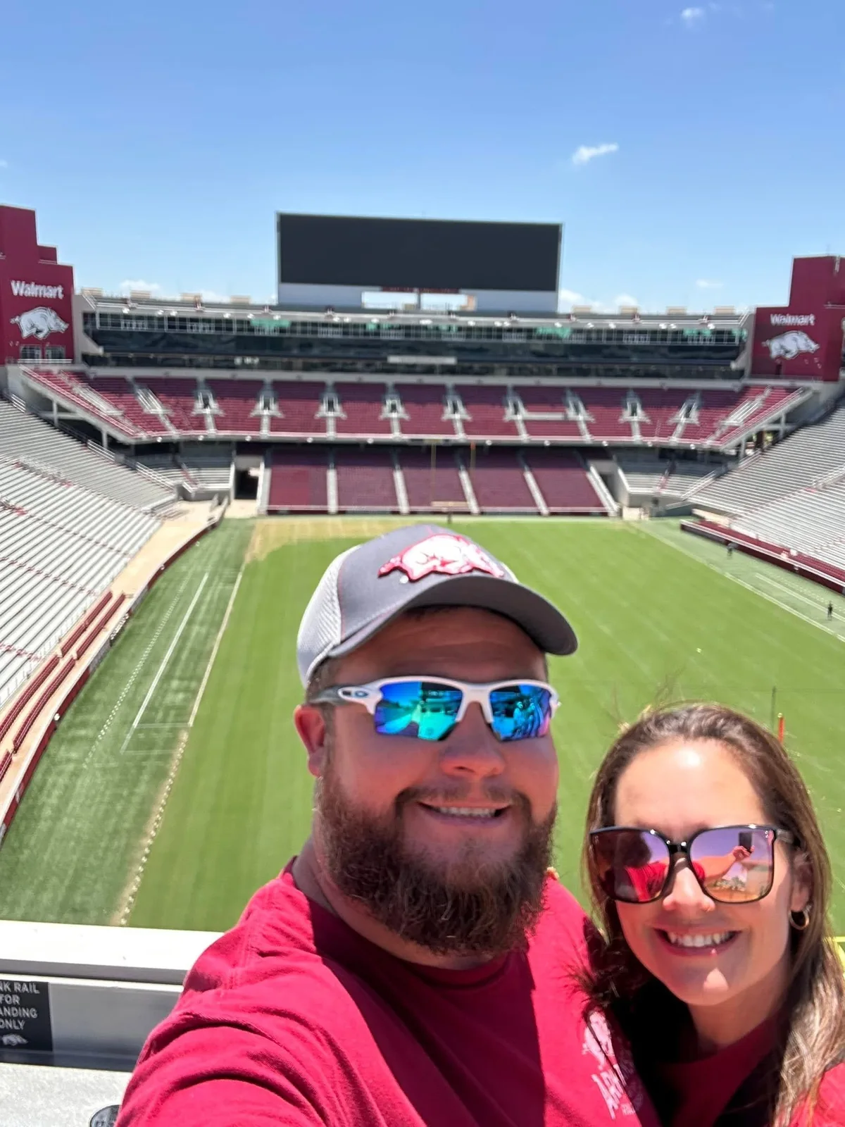 Danny and Diedre smiling together at Donald W. Reynolds Razorback Stadium